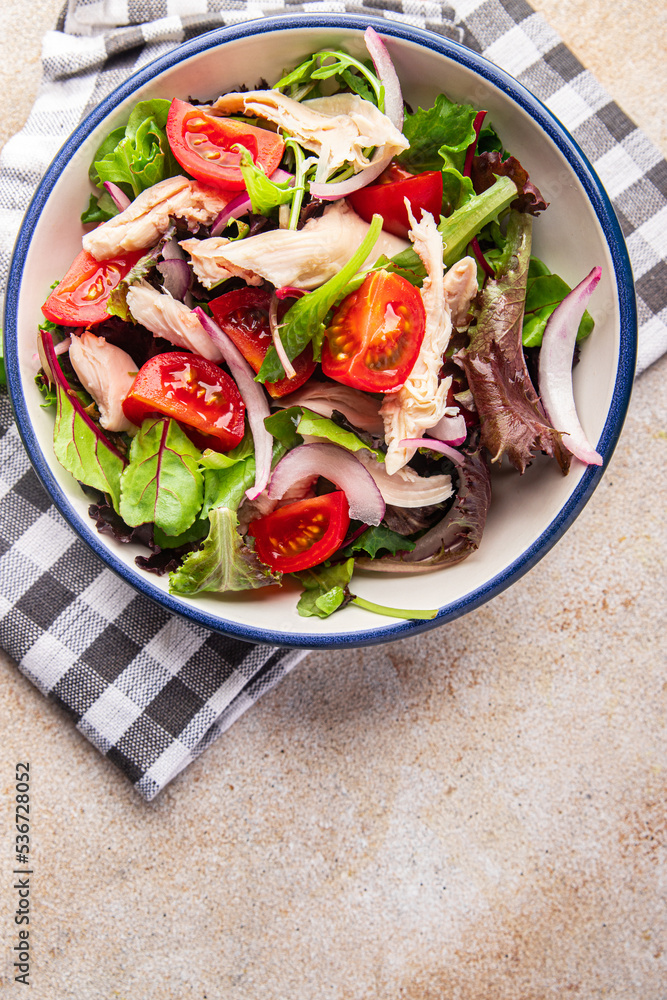 salad chicken breast, tomato, green lettuce, red onion healthy meal food snack diet on the table copy space food background rustic top view keto or paleo diet