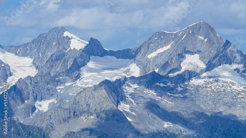 The landscape of the Swiss Alps, with the highest peaks and glaciers of the canton of Valais viewed from the Simplon Pass, Switzerland - July 2022. © Roberto