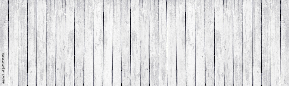 White painted old wooden rustic fence. Whitewashed rough wood board large texture. Light grunge background White painted old wooden rustic fence. Whitewashed rough wood board large texture. Light grunge background