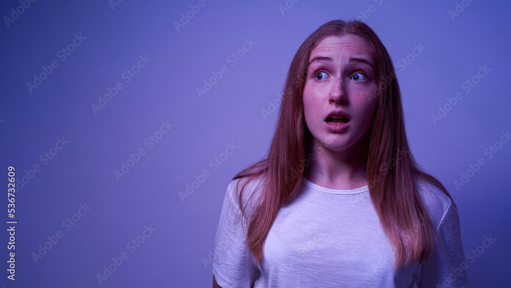 Fototapeta premium Surprised cute caucasian female teenage look away