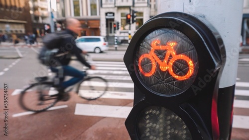 Bikes and bikers are riding in Amsterdam 