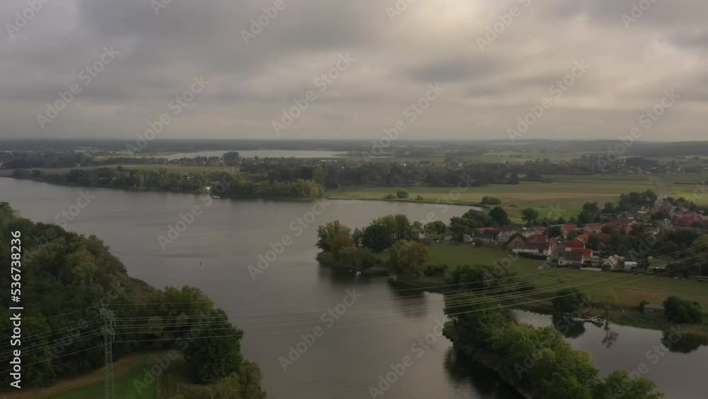drone shot of lake with village on riverbank and beautiful landscape drone shot of lake with village on riverbank and beautiful landscape