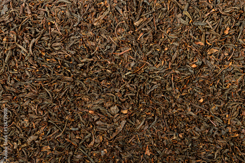 dry black tea leaves as background texture
