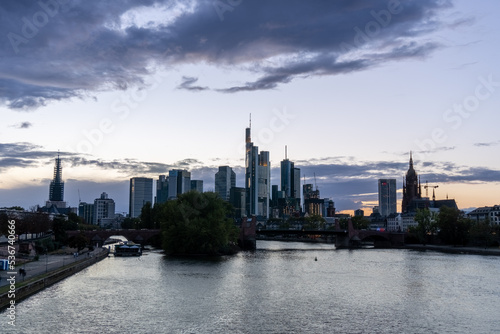 Sunset in the city of Frankfurt, seen from the Bubis bridge, view of the old part of the city and the financial and office area.
