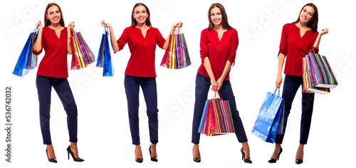 Portrait of young happy smiling pretty woman with shopping bags, isolated over white background.