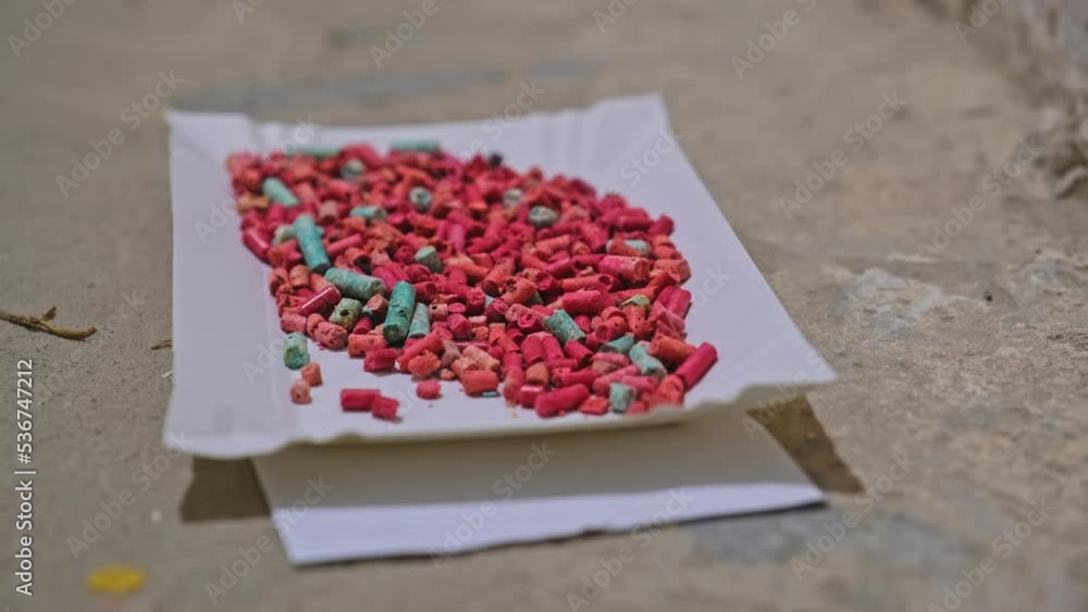 Rat Poison Pellets Granules for Killing Rodent Pest Mouse Left on Basement Floor Parallax Rat Poison Pellets Granules for Killing Rodent Pest Mouse Left on Basement Floor Parallax