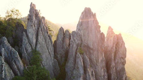 Flying around feather rocks of taganay national park mountains at sunrise photo