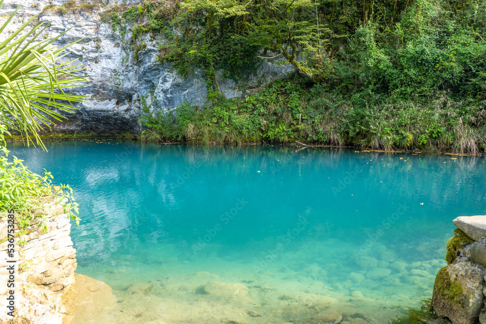 Alpine lake with clear blue water among the rocks in summer in the mountains of Abkhazia Alpine lake with clear blue water among the rocks in summer in the mountains of Abkhazia