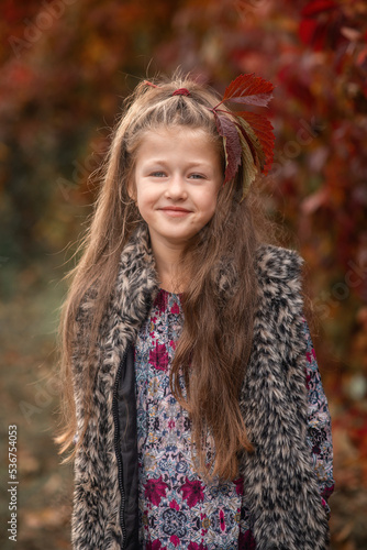 portrait of a girl in autumn park