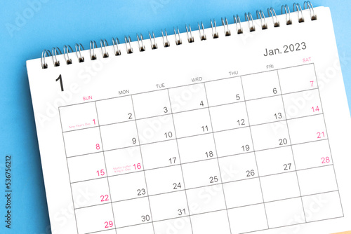 calendar January 2023 top view on a blue background © sai