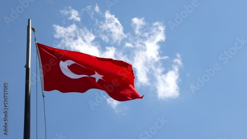 Turkish flag waving against the cloudy sky. Turkish national holidays video. 29th october republic day or cumhuriyet bayrami or 19th may or 30th august or zafer bayrami background video. photo