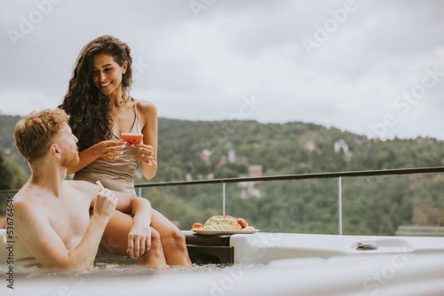 Young couple enjoying in ou...