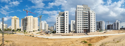 City construction among desert dunes. Building yard of Housing construction of houses in  new area of the city Holon in Israel