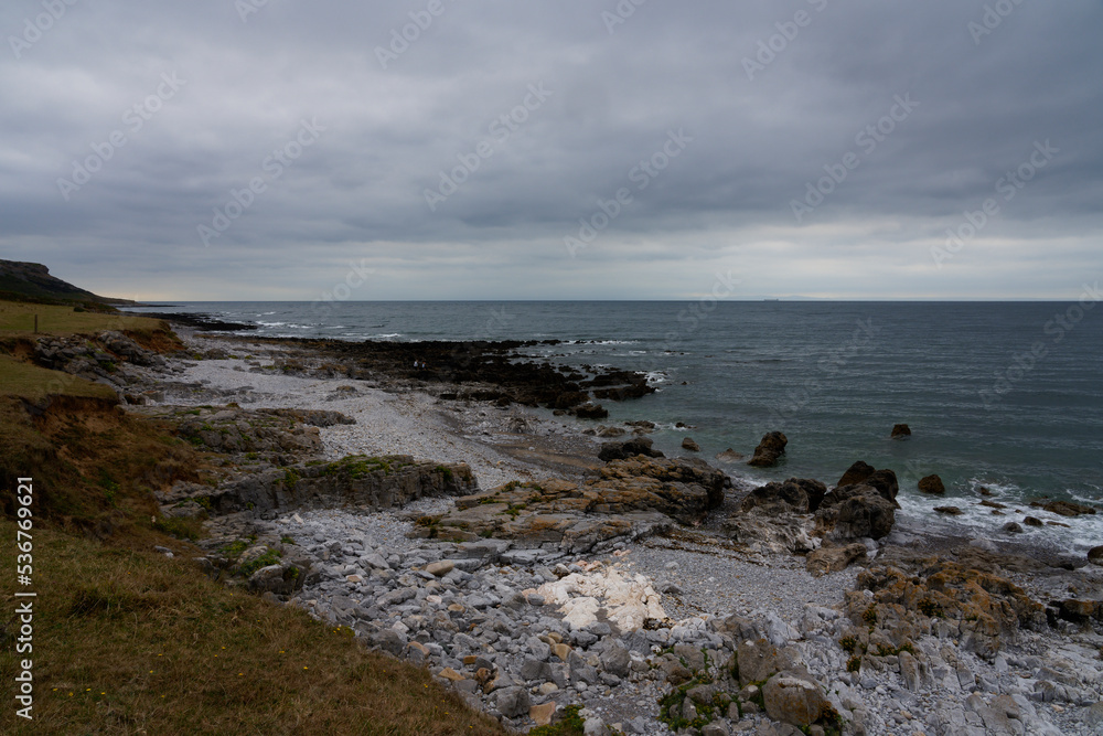 Grey skies over the rocky shores of Oxwich Bay.