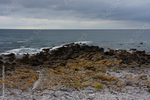 Gloomy day on the rocky shores of Oxwich Bay.