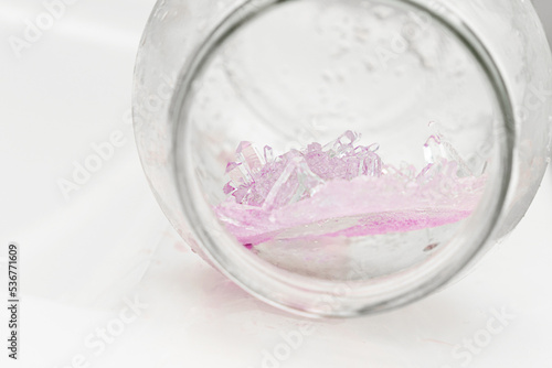 Chemical experiment on growing crystals. Crystal grown in a jar.