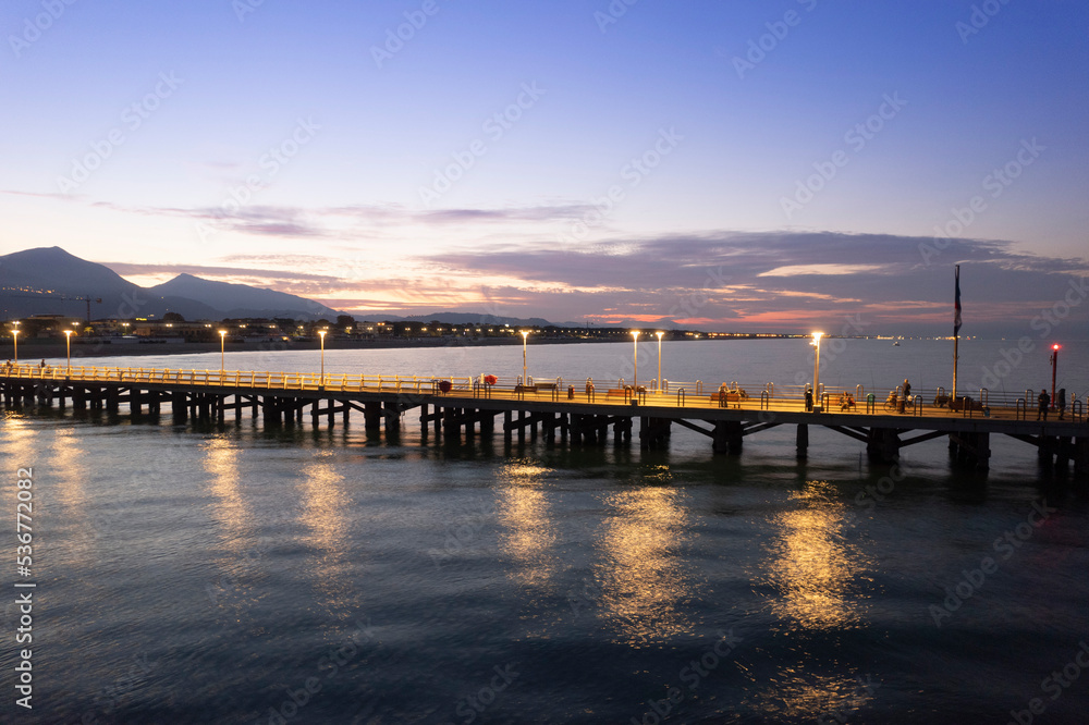 Fototapeta premium Night aerial view of the pier of Forte dei Marmi Tuscany Italy