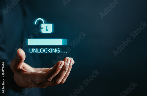 Tablou pe pânză Businessman unlock success idea, creativity concept, Hand holding unlock virtual icon graphic Business innovation and technology concept