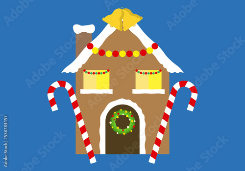 Icono de casa de jengibre con decoración navideña.