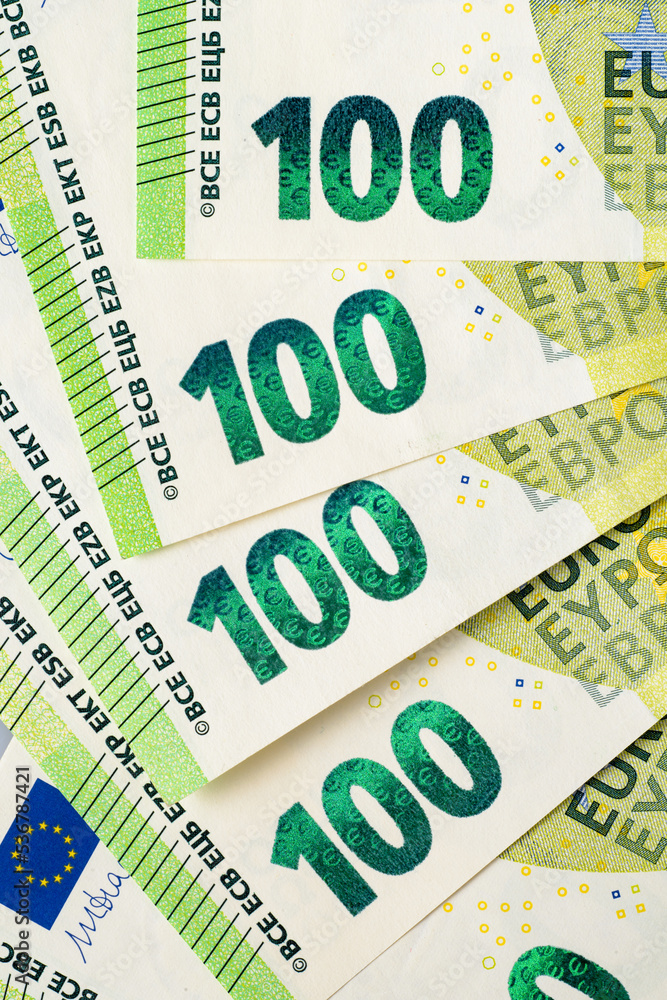 Hundred Euro banknotes in a row. European Union Currency. Hundred Euro banknotes in a row. European Union Currency.