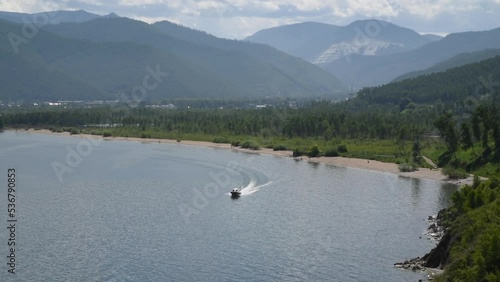 Boat moving along Lake Baikal. 