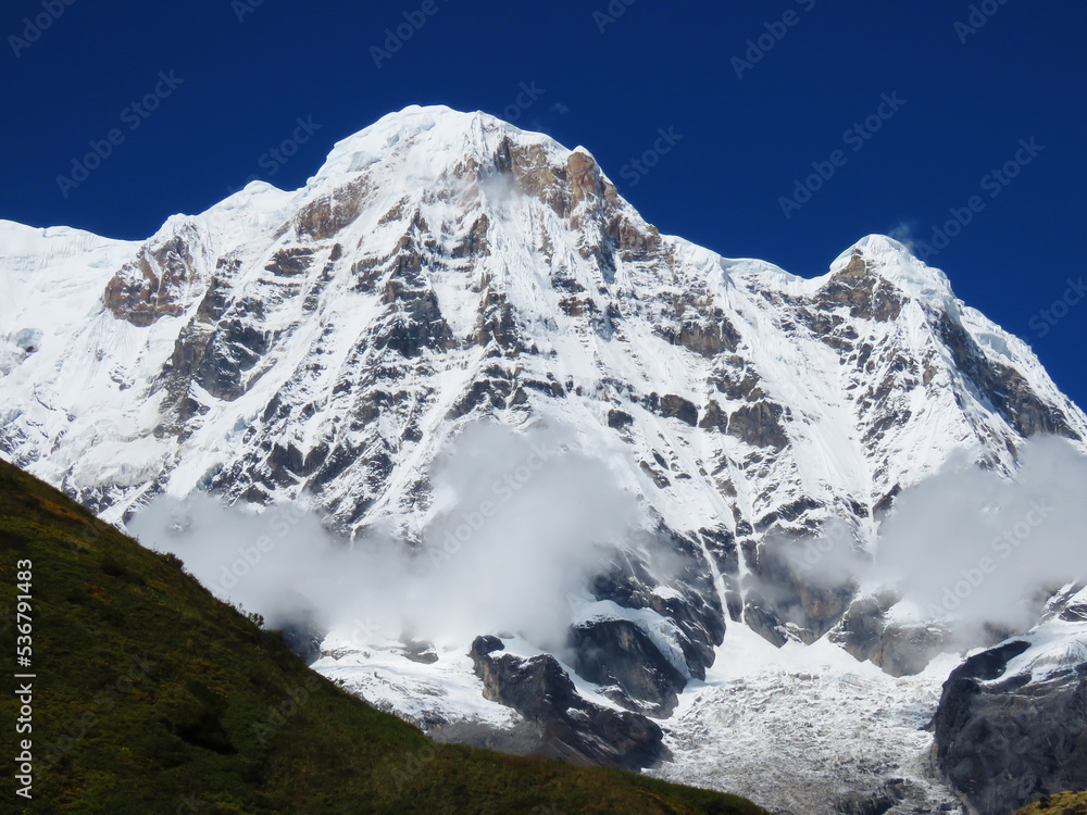 Morning view of Mount Annapurna, Nepal Himalayas mountains, Annapurna circuit trekking trail, Snow covered mountain.