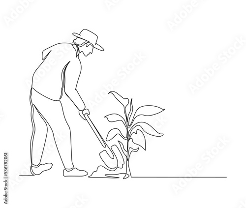 Continuous line art drawing of farmer shoveled the soil with the plants using a shovel. Farming single line art drawing vector illustration.