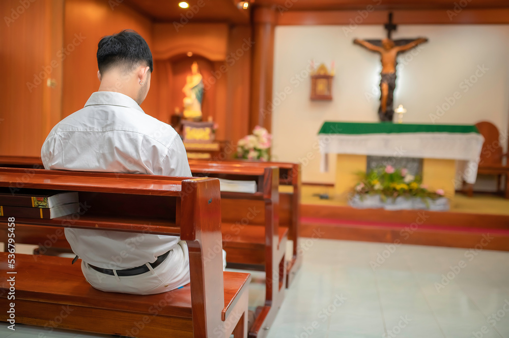 Christian man asking for blessings from God,Asian man praying to Jesus Christ Christian man asking for blessings from God,Asian man praying to Jesus Christ