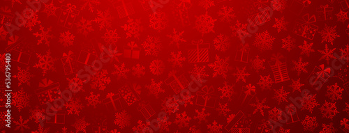 Background made of complex Christmas snowflakes and gift boxes with different patterns, in red colors