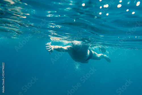 Sporty man swims fast in the sea © alphaspirit