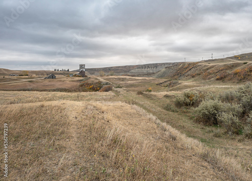 Abandoned buildings and railroad in the ghost town of Sharples, Alberta photo