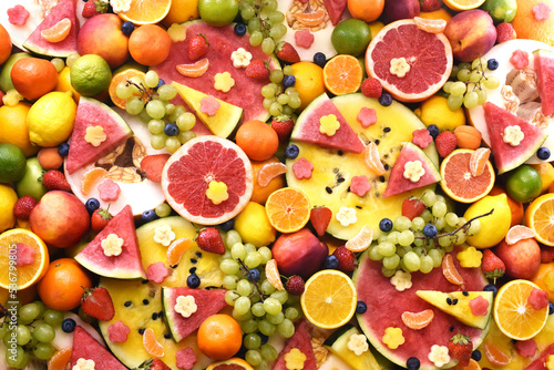 Fresh ripe organic fruits from market  watermelon and orange  grape and lemon  apricot and berries  apple and grapefruit