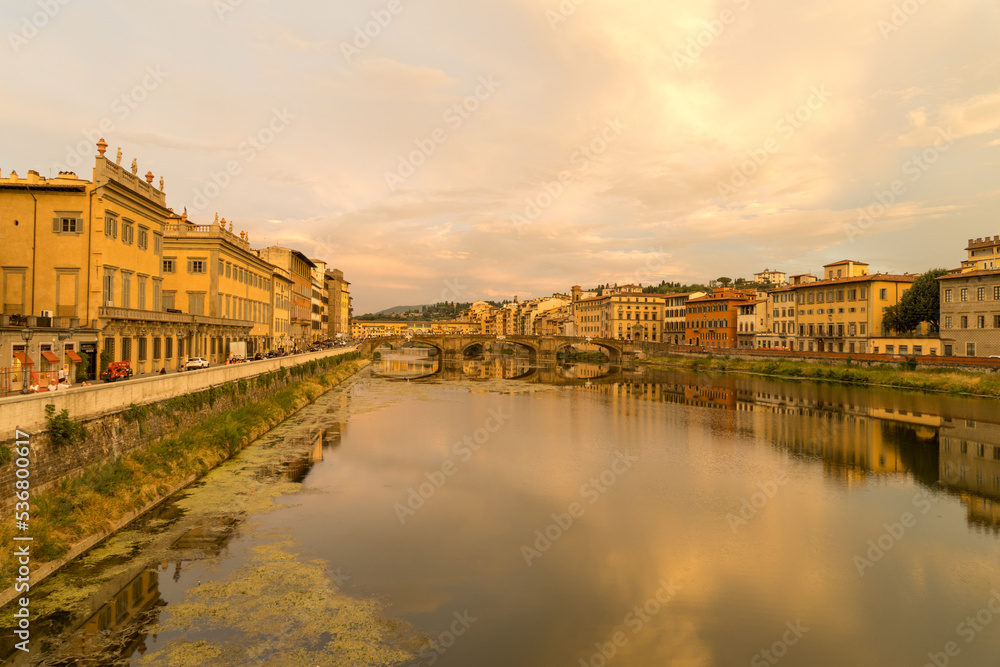 View of Florence city during sunset shot from Bridge over river arno.