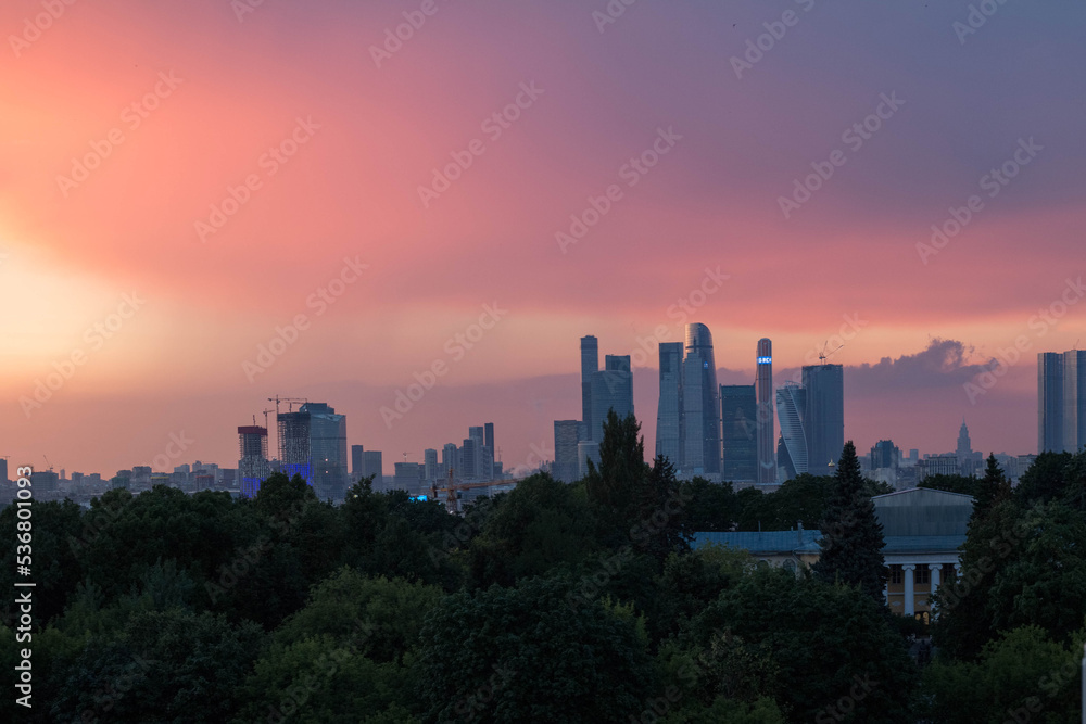 Panorama from Moscow city. Purple sunset sky. Sunset view of the city in the distance.