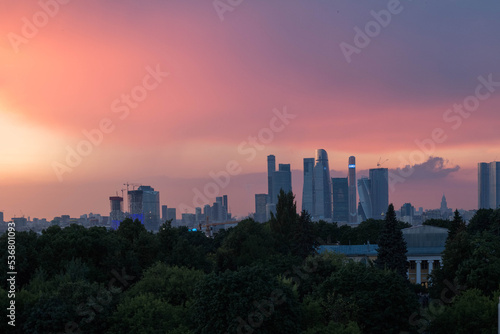 Panorama from Moscow city. Purple sunset sky. Sunset view of the city in the distance. © alisaaig