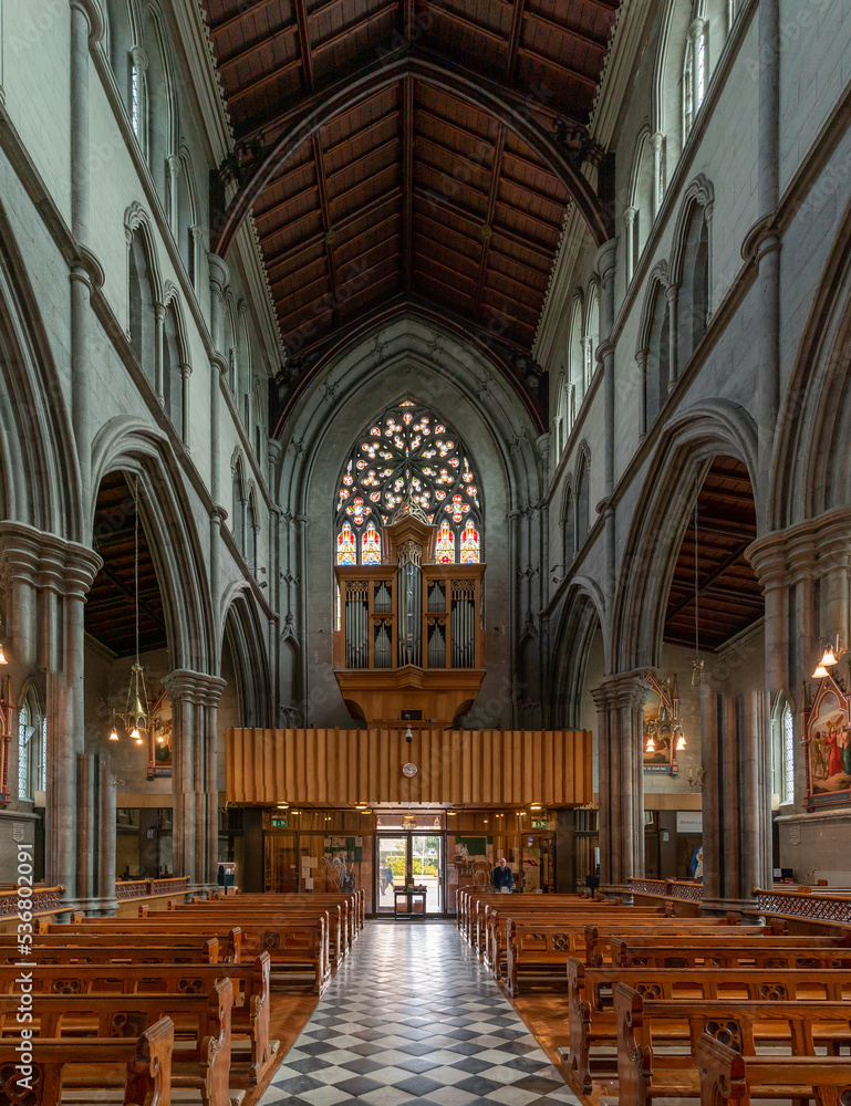Fototapeta premium view of the central nave of the St. Mary's Cathedral in Kilkenny with the church organ above the entrance