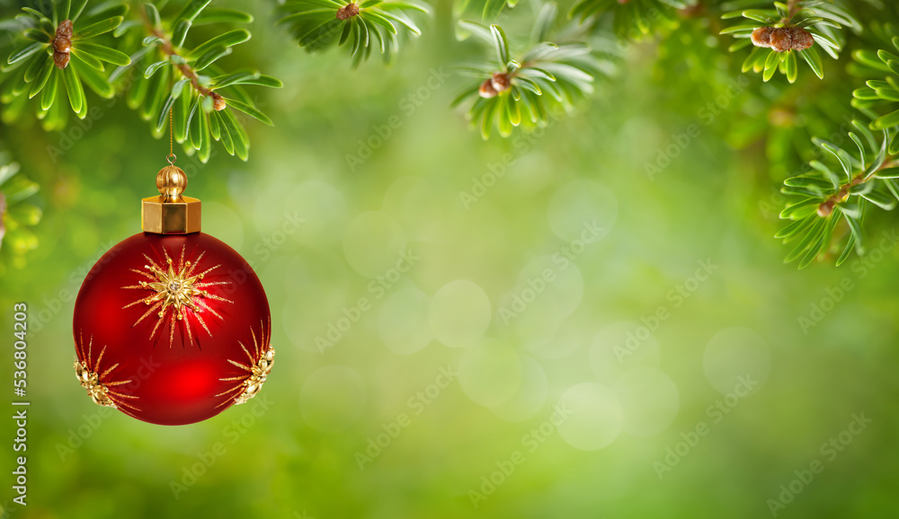 Beautiful green fir tree branches and Christmas red ball with gold stars. Christmas ornaments and New Year decor. Christmas and winter concept. Beautiful green fir tree branches and Christmas red ball with gold stars. Christmas ornaments and New Year decor. Christmas and winter concept.