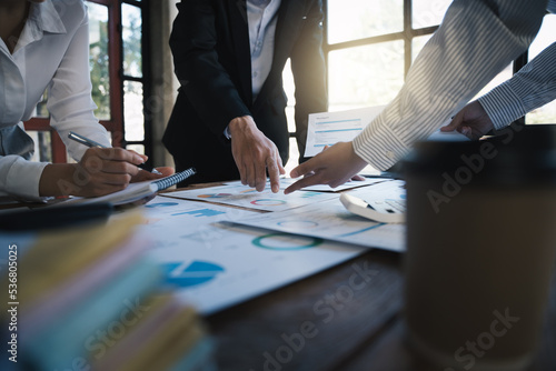 Business people making report, calculating using calculator and checking montly budget, Audit concept. photo