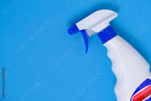 Sprayer for washing windows and plumbing blue background.