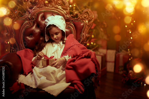 child opening xmas gift