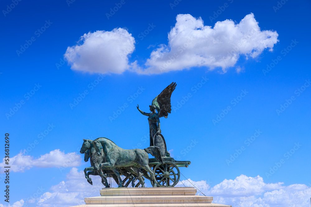 The majestic Altar of the Fatherland: the Quadriga of Unity on the summit of one of the two propylaea. The inscription 'Hic manebimus optime ' meaning 