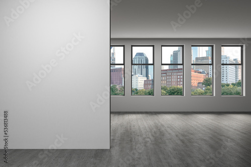 Downtown Nashville City Skyline Buildings from High Rise Window. Beautiful Expensive Real Estate overlooking. Empty room Interior. Mockup wall. Skyscrapers Cityscape. Day. Tennessee. 3d rendering.