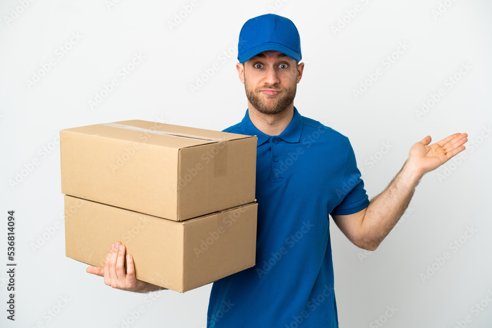 Delivery man over isolated white background having doubts while raising hands Delivery man over isolated white background having doubts while raising hands