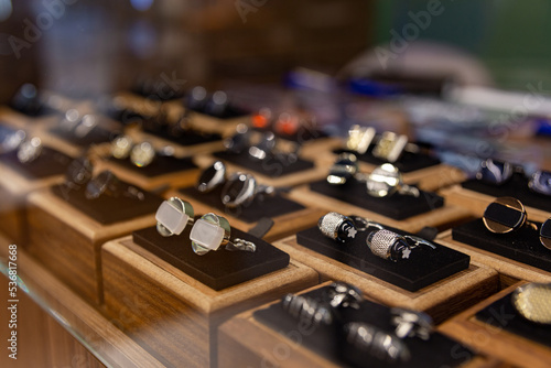 Quadro su tela Boxes with cufflinks on shelf in boutique.