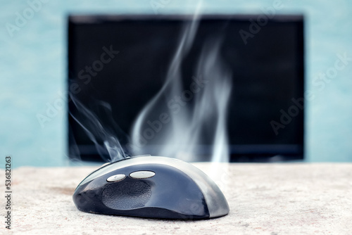 Quadro em tela Smoke is coming from the computer mouse near the computer due to a malfunction