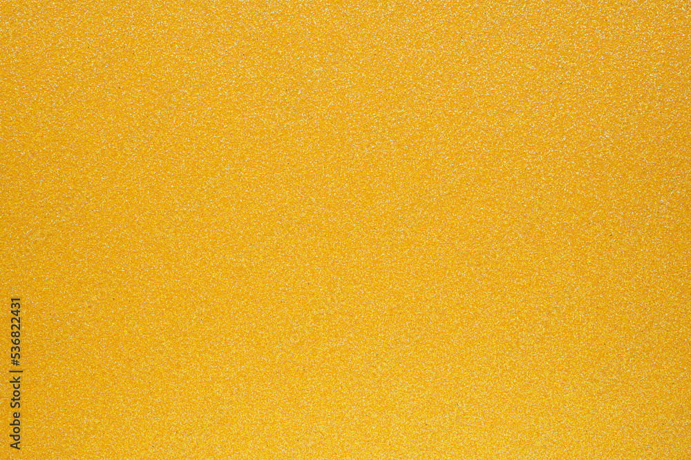Naklejka premium Yellow glitter texture xmas background.