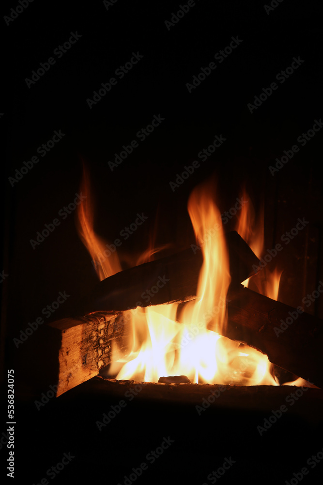 Bonfire burning and bringing in some heat, light and lovely atmosphere. Enjoy the fire in fireplace, as a campfire or simply as a background image. Closeup of abstract red, orange and yellow flames. Bonfire burning and bringing in some heat, light and lovely atmosphere. Enjoy the fire in fireplace, as a campfire or simply as a background image. Closeup of abstract red, orange and yellow flames.