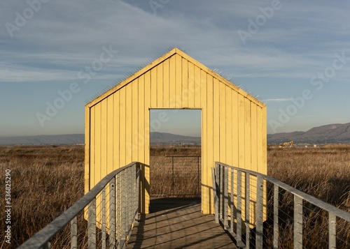 Closeup of a wooden entrance of a barn on the Alviso Marina Boat Launch Ramp in San Jose, California photo