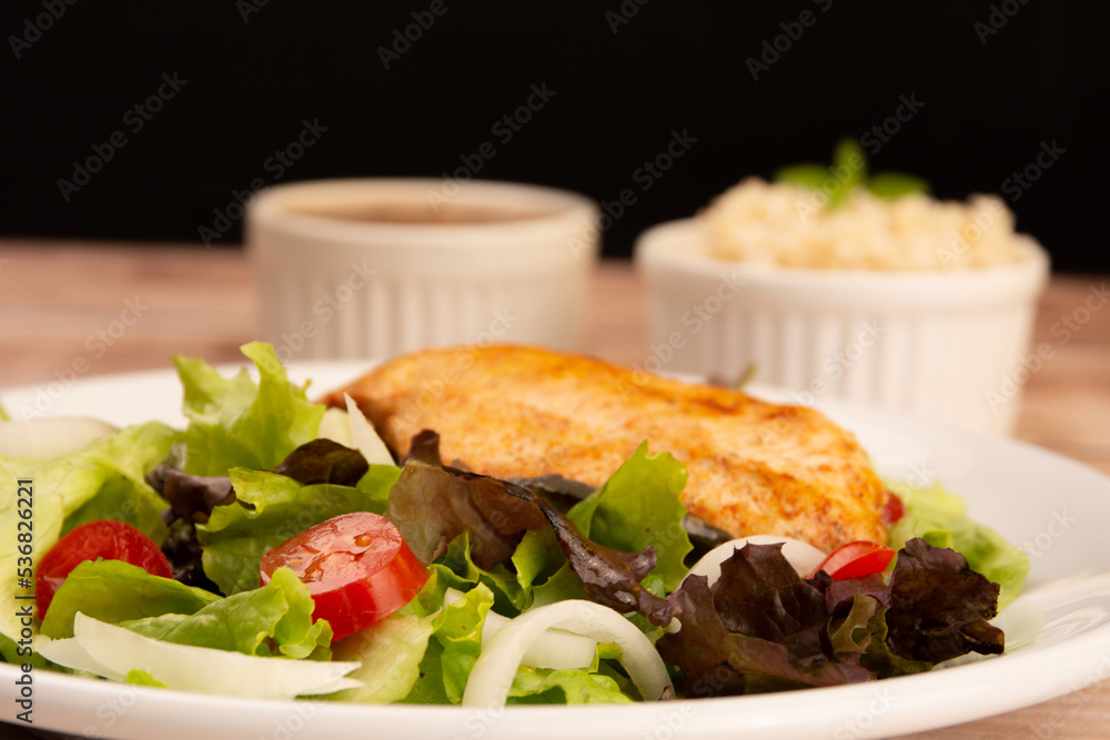 Healthy salad with chicken on a plate, lettuce, and organic vegetables, Healthy salad with chicken on a plate, lettuce, and organic vegetables,
