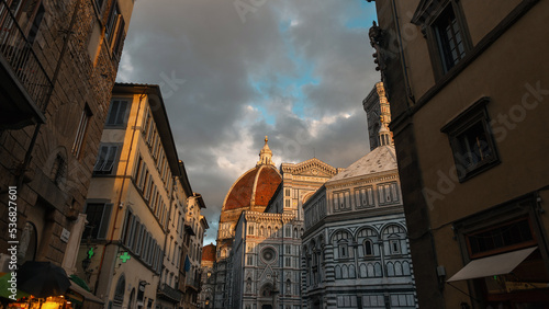 Beautiful old historic city of Florence in Italy with its vintage buildings and streets at sunset. Amazing Cattedrale di Santa Maria del Fiore. Street view. Holidays and travel in Italy photo
